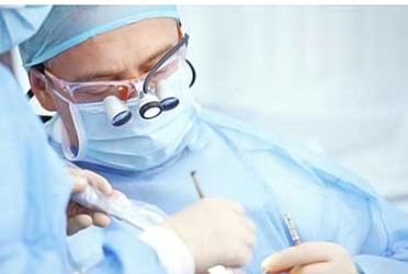 A doctor wearing surgical gear