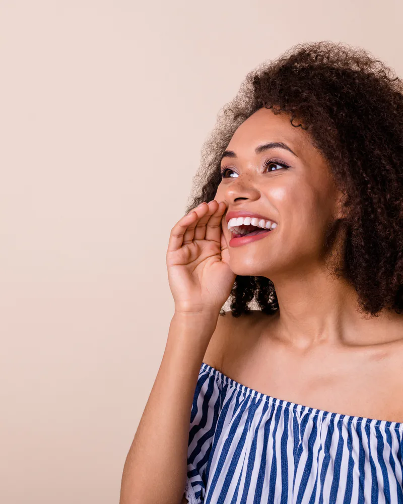 Joyful smiling patient embracing holistic wellness